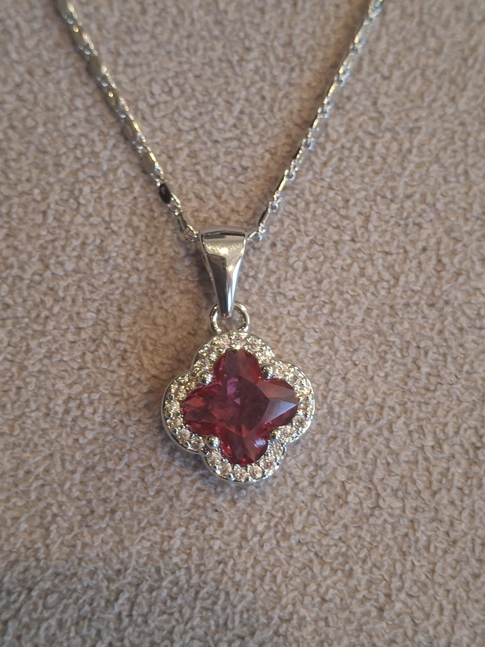 Silver Pendant Necklace with Red Crystal Clover and Halo Accent